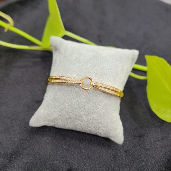 Elegant gold bracelet with white stones and circular centre design for women – 26BR0001