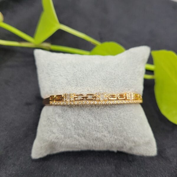 White stone gold bracelet lock type for women with elegant design imitation jewellery for wedding and party wear in Erode