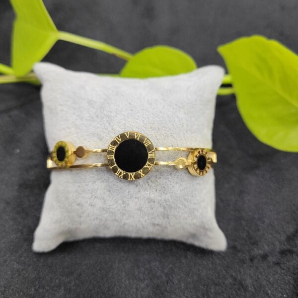 Black clock design gold bracelet with Roman numeral circular centre open type bracelet for women – 26BR0003