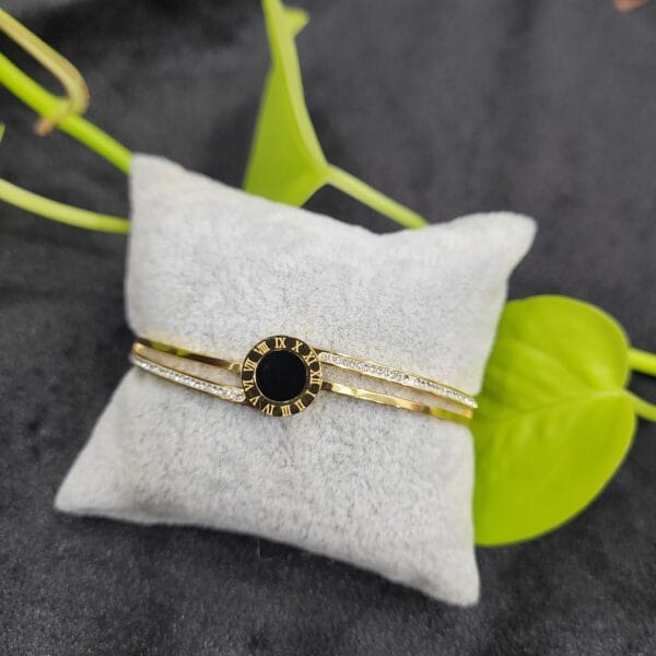 Clock design gold bracelet lock type with Roman numeral centre and crystal detailing for women – 26BR0005